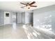 Living room with tile floors, ceiling fan and access to backyard at 3604 Rockaway Dr, Holiday, FL 34691