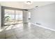 Living room with tile floors and sliding glass doors to a patio at 3604 Rockaway Dr, Holiday, FL 34691