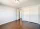 Bright bedroom featuring hardwood floors and ample closet space at 3604 Rockaway Dr, Holiday, FL 34691