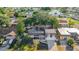 Aerial view showing the house's location in a residential neighborhood near a lake at 3604 Rockaway Dr, Holiday, FL 34691