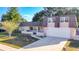 Exterior view of a two-story house with a brown roof and attached garage at 3604 Rockaway Dr, Holiday, FL 34691