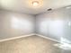 Simple bedroom with tile flooring and neutral walls at 3604 Rockaway Dr, Holiday, FL 34691
