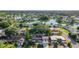 Aerial view of home near lake and community at 3604 Rockaway Dr, Holiday, FL 34691