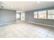 Bright and spacious living room with tile floors and neutral walls at 3604 Rockaway Dr, Holiday, FL 34691