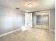Bright bedroom with mirrored closet doors and tile flooring at 3604 Rockaway Dr, Holiday, FL 34691