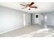 Living room with tile floors, ceiling fan and access to other rooms at 3604 Rockaway Dr, Holiday, FL 34691