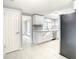 Modern kitchen with white cabinets and granite countertops at 3604 Rockaway Dr, Holiday, FL 34691