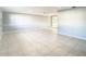 Open living space with tile floors, sliding glass doors, and access to a patio at 3604 Rockaway Dr, Holiday, FL 34691