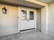 White double front doors with glass panels, adding curb appeal to the home at 3604 Rockaway Dr, Holiday, FL 34691