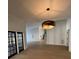 Elegant dining room with hardwood floors and a modern chandelier at 5001 Troydale Rd, Tampa, FL 33615