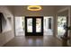 Bright and airy entryway with hardwood floors and large doors at 5001 Troydale Rd, Tampa, FL 33615