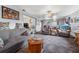 Spacious living room with comfortable seating and a view into another room at 589 59Th S St, St Petersburg, FL 33707