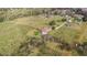 Aerial view of a house on a large lot with surrounding farmland at 331 Lewis Rd, Lithia, FL 33547