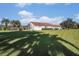 Large backyard with lush grass and a partial view of the house at 331 Lewis Rd, Lithia, FL 33547