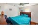 Bright bedroom featuring a ceiling fan and large bed at 331 Lewis Rd, Lithia, FL 33547