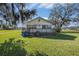 Small house with porch and large yard at 331 Lewis Rd, Lithia, FL 33547