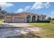 Home's exterior showcases a three-car garage and fountain at 331 Lewis Rd, Lithia, FL 33547