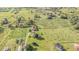Aerial view of property showcasing a house, farmlands, and additional structures at 331 Lewis Rd, Lithia, FL 33547