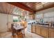 Kitchen with wood cabinets and a dining area at 331 Lewis Rd, Lithia, FL 33547