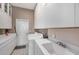Laundry room with washer, dryer, cabinets, and utility sink at 331 Lewis Rd, Lithia, FL 33547