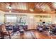 Living room with wood ceiling and a home office setup at 331 Lewis Rd, Lithia, FL 33547