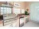 Stainless steel appliances and brick countertops feature in this outdoor kitchen at 331 Lewis Rd, Lithia, FL 33547
