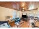 Spacious living room with wood floors and a wood paneled ceiling at 331 Lewis Rd, Lithia, FL 33547