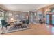 Living room with hardwood floors, comfortable seating, and large windows providing natural light at 331 Lewis Rd, Lithia, FL 33547