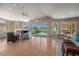 Spacious Gathering room with hardwood floors, fireplace, and pool view at 331 Lewis Rd, Lithia, FL 33547