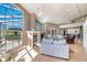 Sunlit living room featuring a fireplace and views of the backyard at 331 Lewis Rd, Lithia, FL 33547