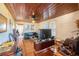 Living room features wood ceiling, hardwood floors, and a leather couch at 331 Lewis Rd, Lithia, FL 33547