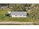 Aerial view of a single story home with a large yard and surrounding agricultural land at 331 Lewis Rd, Lithia, FL 33547