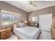 Cozy bedroom with wood floors, a double bed and a ceiling fan at 331 Lewis Rd, Lithia, FL 33547