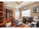 Functional home office with built-in wooden shelving and desk at 331 Lewis Rd, Lithia, FL 33547