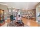 Spacious living area with hardwood floors, featuring a dining area and stained glass entryway at 331 Lewis Rd, Lithia, FL 33547