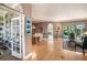 Bright and spacious living room with hardwood floors, built in bookcases and access to a sunroom at 331 Lewis Rd, Lithia, FL 33547