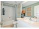 Modern bathroom with white vanity, subway tile, and bathtub at 11294 Linden Depot Rd, San Antonio, FL 33576