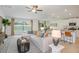 Open living room and kitchen layout with a large sectional sofa at 11294 Linden Depot Rd, San Antonio, FL 33576
