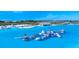 Aerial view of a large lagoon with beach and water features at 11294 Linden Depot Rd, San Antonio, FL 33576
