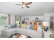 Open living room and kitchen layout with a large sectional sofa at 11294 Linden Depot Rd, San Antonio, FL 33576