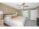 Spacious bedroom with king-size bed and plenty of natural light at 11294 Linden Depot Rd, San Antonio, FL 33576
