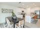 Bright kitchen with island, stainless steel appliances, and white cabinets at 11294 Linden Depot Rd, San Antonio, FL 33576