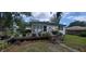 Charming home with a spacious deck and lush landscaping at 1315 E Tomlin St, Plant City, FL 33563