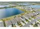 Aerial view of house with solar panels and neighborhood at 602 Olive Conch St, Ruskin, FL 33570