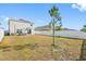 Large backyard with white vinyl fence at 602 Olive Conch St, Ruskin, FL 33570