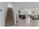 Carpeted staircase with kitchen and living room visible at 602 Olive Conch St, Ruskin, FL 33570