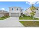 Two-story house with attached garage, front yard, and driveway at 602 Olive Conch St, Ruskin, FL 33570