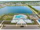 Community pool and clubhouse with playground nearby at 602 Olive Conch St, Ruskin, FL 33570