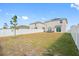 Large backyard with white vinyl fence at 602 Olive Conch St, Ruskin, FL 33570