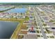 Aerial view of home community, featuring a lake and numerous houses at 602 Olive Conch St, Ruskin, FL 33570